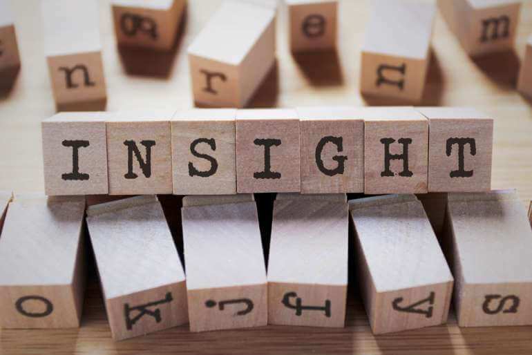 Scrabble tiles spelling 'insight'