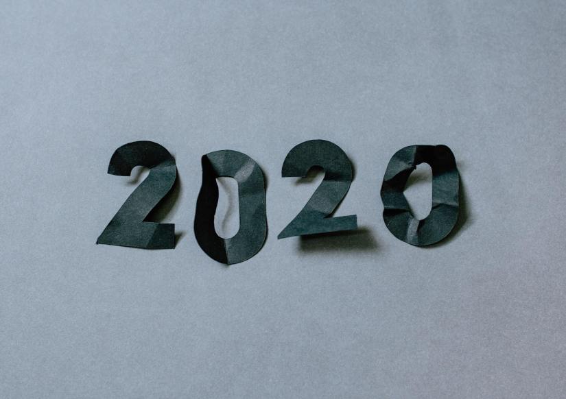 Crumpled paper numbers spelling '2020'